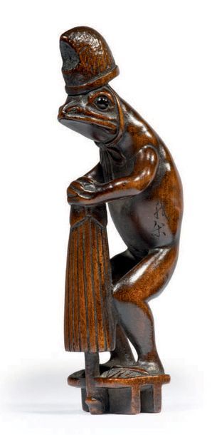 Epoque EDO (1603 - 1868), XIXe siècle Netsuke en bois, grenouille debout portant...