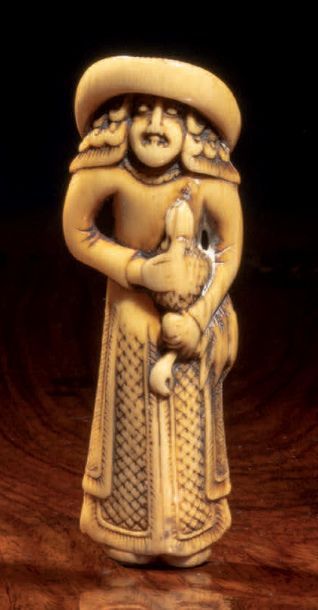 Milieu Epoque EDO (1603 - 1868) * Netsuke en ivoire représentant un hollandais portant...