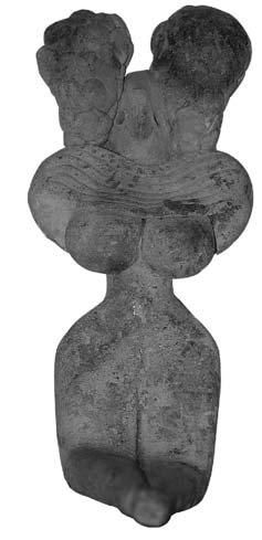MEHRGARH (3000 av. J.C.) Idole féminine assise, les mains sous les seins. Le collier...