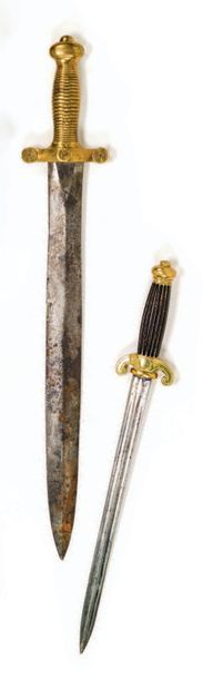 null Deux armes blanches:
a) Glaive modèle 1831.
Monture en laiton
Lame de Talabot.
b)...