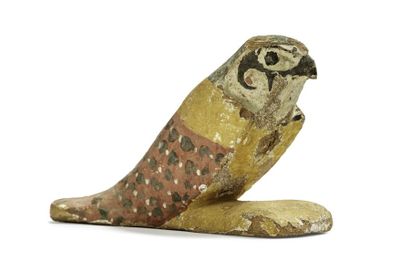 null Faucon Akhem en bois polychrome
Egypte, époque Ptolémaïque
L. 15 cm