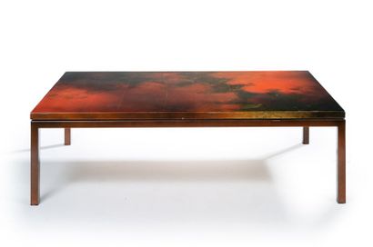 GINETTE CLEMENT (XXème) Table basse à plateau en bois laqué orange et brun reposant...