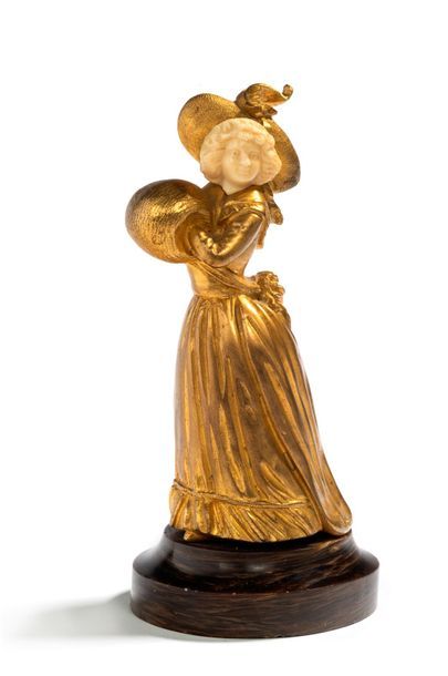 Georges OMERTH (act. 1895-1925) * Elégante au manchon
Statuette chryséléphantine...