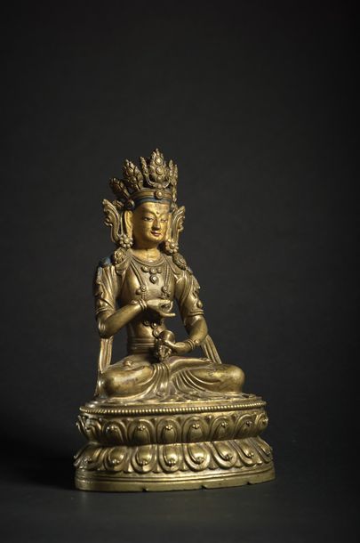 TRAVAIL SINO-TIBETAIN - XVIIIe siècle Brass statuette of Vajradhara, his face lacquered...