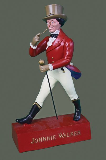 null JOHNNIE WALKER Figurine du célèbre gentleman créé par Tom Browne pour la marque...