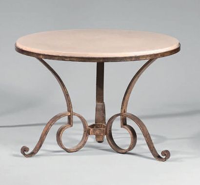 D'APRÈS GILBERT POILLERAT LOW TABLE The circular marble top on wrought iron base...