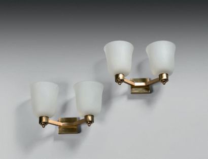 PERZEL TWO PAIRS OF SPLACES Gilded brass and moulded glass, with two light arms.
Signed...