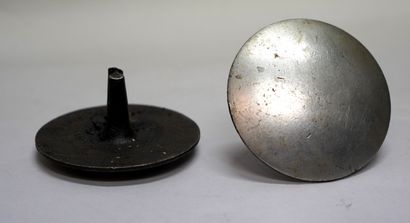  TWO PEDESTRIAN CROSSING NAILS 
Iron, circular shape. 
c. 1960. 
8 x 10 cm.