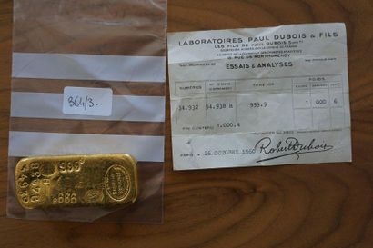 null *A 999-thousandths gold ingot, number 94938 and its test bulletin. Weight: 1,000.4...