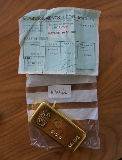 null *A 995-thousandths gold ingot, number 450155 and its test bulletin. Weight:...