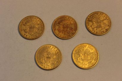 null A collection of five 20 US dollar gold coins: two from 1861, one from 1869,...