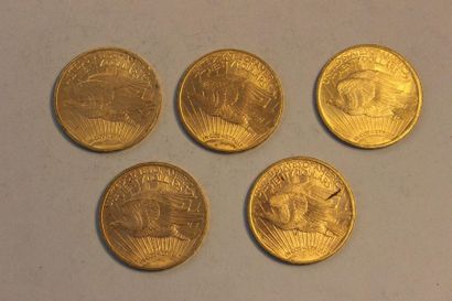 null A collection of five 20-dollar gold coins, three of which date from 1922 and...