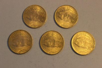 null A collection of five 20-dollar gold coins, two of 1924, two of 1925 and one...