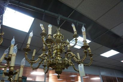 null *Gilt bronze and brass chandelier with ten light arms on two rows, the shaft...