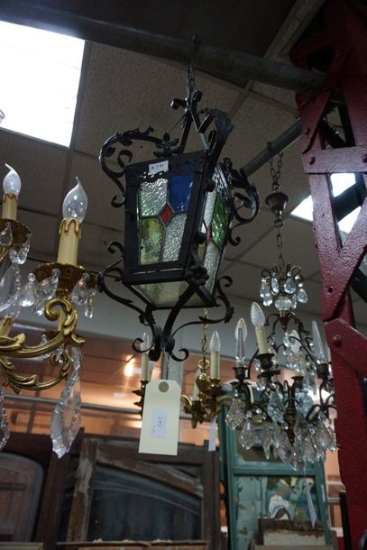 null Wrought iron lantern with foliage decoration and coloured glass. 20th centu...