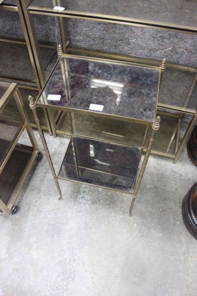 null Set comprising: small brass coffee table with two eglomised glass tops resting...