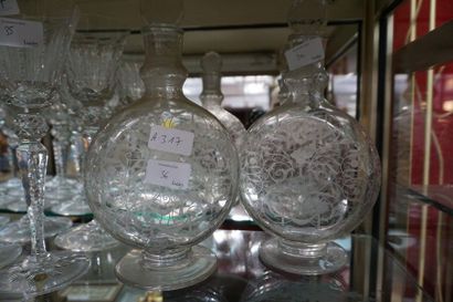 null BACCARAT, Pourer and pair of crystal carafes cut and engraved with rinceaux...