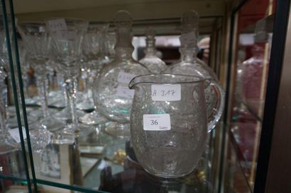 null BACCARAT, Pourer and pair of crystal carafes cut and engraved with rinceaux...