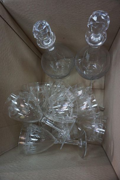 null Parts of engraved crystal glass service glasses decorated with garlands of flowers,...