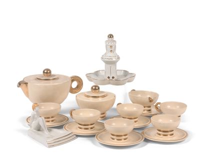 ROBJ . A creamy-white enamelled ceramic coffee set with gilding, including coffee...