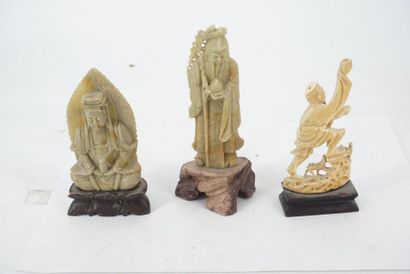 null Meeting of small Asian figurines made of wood and hard stone depicting priests,...