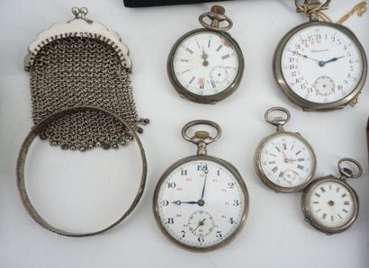 null A lot including: pocket watches, military identification plates, a small purse,...