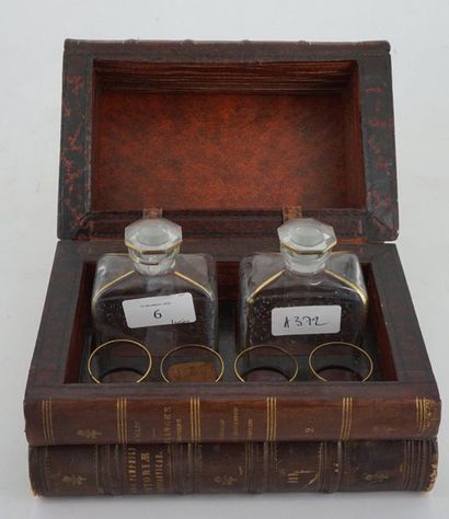 null Small liqueur cellar with two bottles and four glasses hidden in a box simulating...