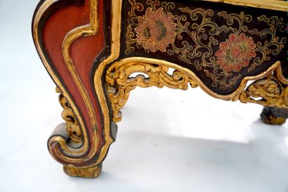 null COMMODE Red and gold lacquered wood, painted with lotus flowers and carved with...
