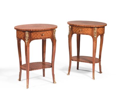 null PAIR OF POCKET TABLES Wood veneered, inlaid with lattice work, the oval top...