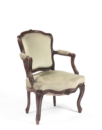 null CABRIOLET CHAIR Carved natural wood, the back decorated with flowers, the armrests...