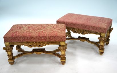 null PAIR OF BANQUETS Carved and gilded wood, the rectangular seat upholstered with...