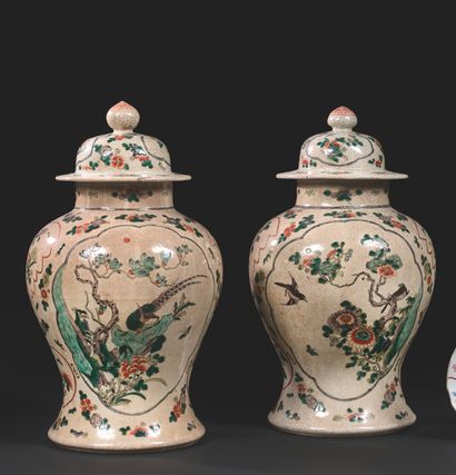 null A PAIR OF GINGER POTS Cracked porcelain, decorated with birds in reserves on...