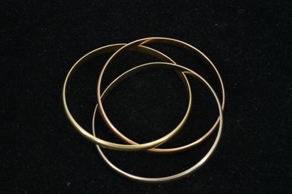 null 
CARTIER -- Bracelet or 18k (750 millièmes) composé de trois anneaux en trois...