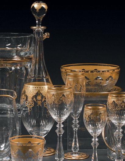 * BACCARAT 
* IMPORTANT GOLDEN AND ETCHED CRYSTAL PIECE SERVICE, decorated with arcatures,...