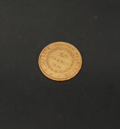 null 1 pièce de 20 francs or 1877. Poids : 6,4 grammes.