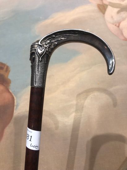 null LUCIEN GAILLARD (1861-1942), AFTER
CANE
The curved silver handle, shaped like...
