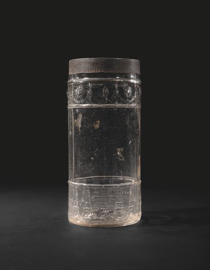 null COOKIE JAR. Molded glass, cylindrical form, the base decorated with a frieze...