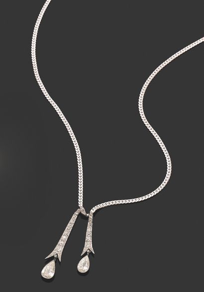 null NECKLACE.
Articulated white gold 750 thousandths, holding in the center two...
