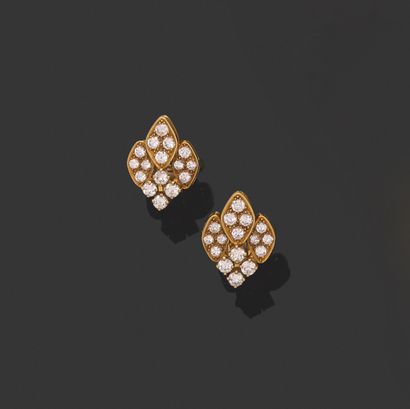 null PAIR OF EARRINGS. 
750 thousandths yellow gold, decorated with diamond motifs,...