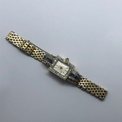 null Petite montre bracelet de dame en or 18K de deux tons, le boitier rectangulaire...