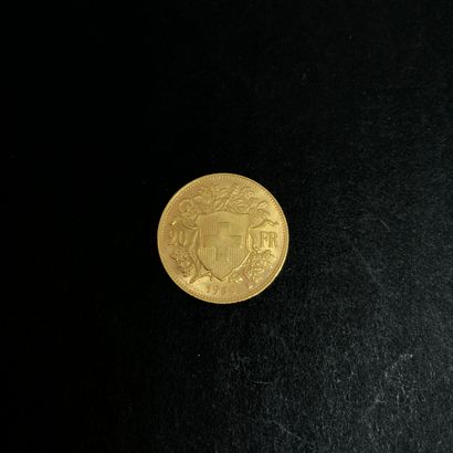 null Une pièce de 20 francs suisse or 1950
Poids : 6,4 g
Usures d'usage