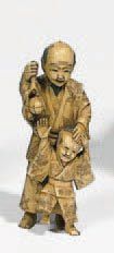 null Statuette en ivoire représentant un homme et son enfant. Japon, fin du XIXème...