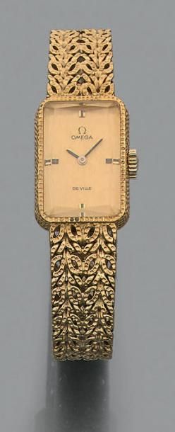 OMEGA DE VILLE Bracelet montre de dame en or jaune 750 millièmes, le bracelet à mailles...