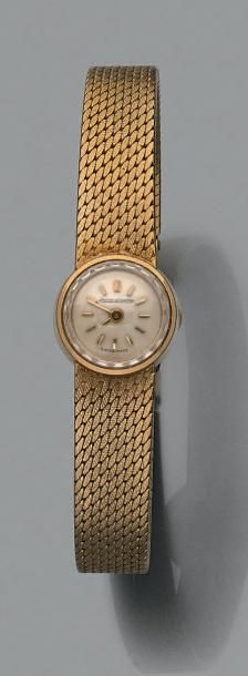 JAEGER LECOULTRE Bracelet-montre de dame en or jaune, petit boîtier circulaire, les...