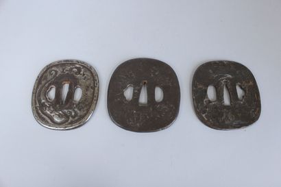 null Set of three iron nade-kaku-gata tsuba with irregular surface, one decorated...