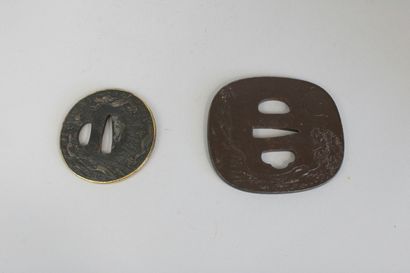 null Two tsuba: iron nagamarugata decorated with pine trees by the water, with a...