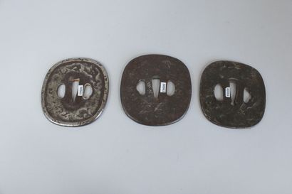 null Set of three iron nade-kaku-gata tsuba with irregular surface, one decorated...