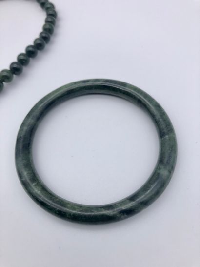 null A green hard stone bracelet and a green hard stone choker necklace, diameter...