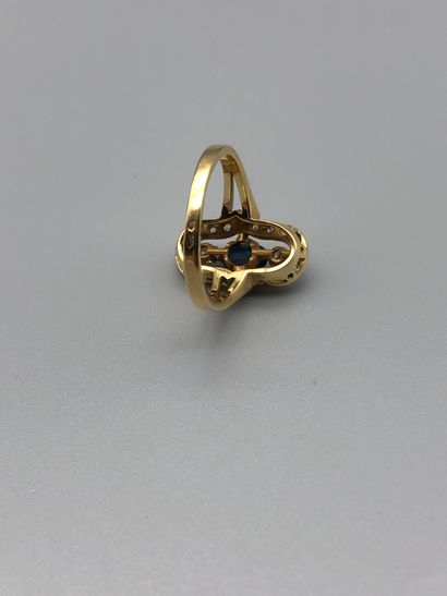 null Ring in yellow gold 750 thousandths, oval motive set with diamonds and a central...