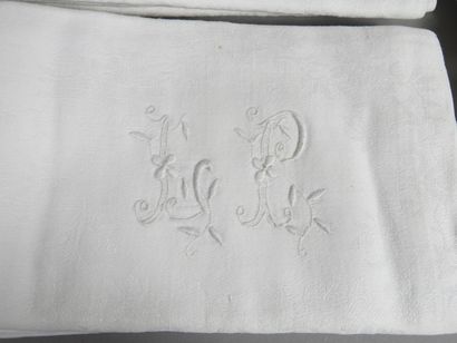 null 12 towels in white Damask monogrammed L P. Dimensions 70 x 68cm.